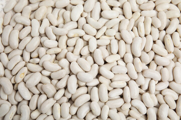 Heap of raw beans as background, top view. Veggie seeds