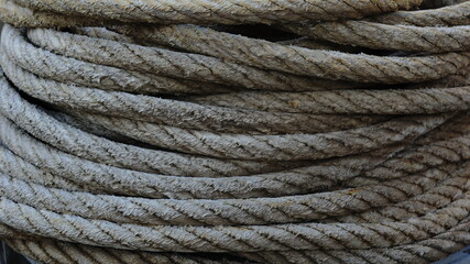 Fototapeta premium stained coiled rope as background