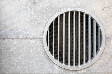round vent in galvanized steel wall