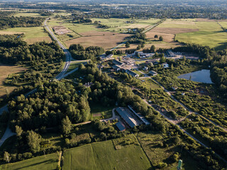 Aerial view of Mezvalde village in sunny summer evening, Latvia.
