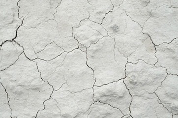 White cracked background texture, light background with dark scratch, the ground near the chalk quarry, copy space