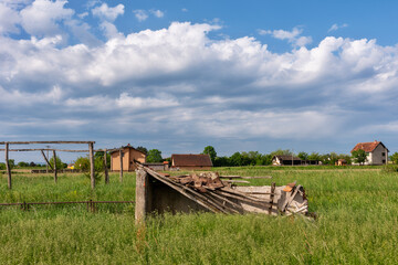 Demolished bench for reserve football players. Abandoned soccer field.