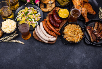 Oktoberfest dishes with beer, pretzel and sausage