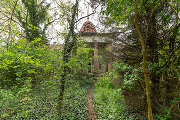 Becej, Serbia - May 01, 2021: The summer house of the noble family Gombos left to the ravages of time. It was built at the beginning of the 20th century
