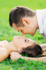 close-up of smiling young couple touching noses with closed eyes