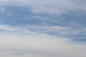 Naklejka na ściany i meble Clouds on bright blue sky background