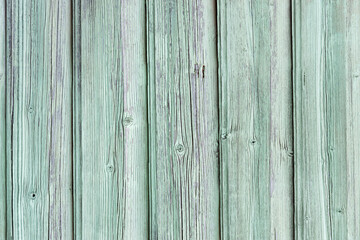 Natural wood background with faded green paint