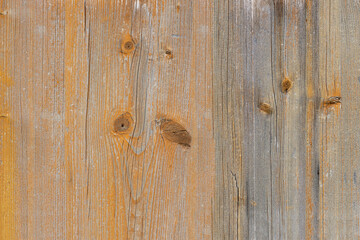 Natural wood background with faded yellow paint