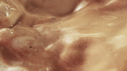 Fototapeta premium Macro shot of foamy coffee drink