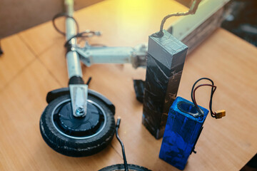 Electric scooter repair, electric vehicle battery replacement. © velimir