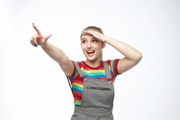 attractive girl gestures with her index finger. advertising concept. photo shoot on a white background