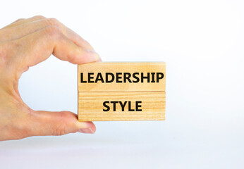 Leadership style symbol. Wooden blocks with words 'Leadership style' on beautiful white background. Businessman hand. Business and Leadership style concept. Copy space.