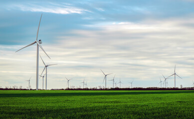 Wind turbines generating electricity with blue sky - energy conservation concept