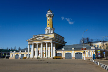 Fototapeta na wymiar Famous Fire Observation Tower on Central Susaninskaya Square. Best watchtower in Russia. Russian late classicism style. Kostroma, one of the most popular cities of tourist route Golden Ring of Russia