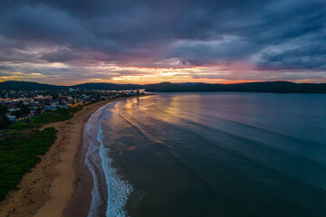 Rainy day aerial sunrise at the beach