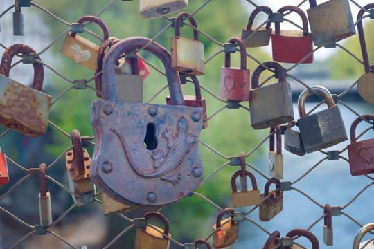Padlocks (love locks) on a bridge railing
