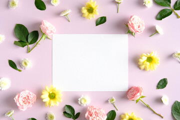 Blank greeting card mockup and flowers on pink background. Happy Mother's Day, Birthday,...