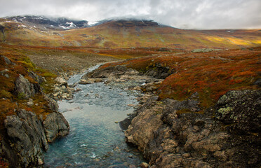 Sunrise at one of the streams crossing Kungsleden trail in September, close to Alesjaure, Swedish Lapland.