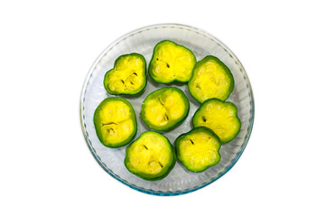 Green zucchini (cucurbita) in a round glass dish