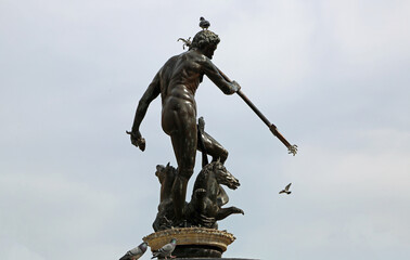 Neptune's sculpture with pigeon  - 17th century historic fountain in Long Market, Gdansk, Poland