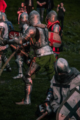 Knights fighting at sunset outdoors