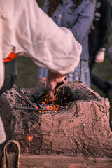 Forging outdoors and sparkles around macro 