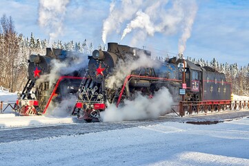 Soviet mainline freight steam locomotive L2331 of the USSR. Retro transport. Operating railway and passenger transport. It is of an entertaining nature.