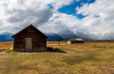 historic Moulton barns n Mormons' Row against the dramatic Teton mountain range  in Wyoming.