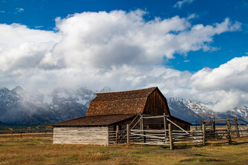 historic Moulton barns n Mormons' Row against the dramatic Teton mountain range  in Wyoming.