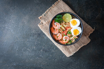 instant noodles ramen in spicy soup with shrimps (Tom Yum Kung) - Asian food style. Pasta, Noodles, junk food concept
