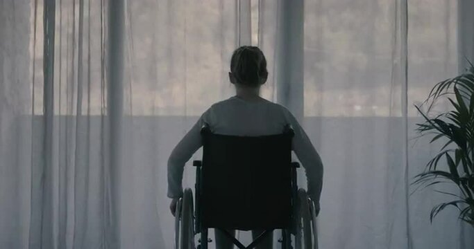 Disabled woman at home alone