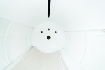 hyperbaric pressure chamber for oxygen therapy, white background interior