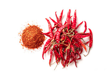dried red chili peppers with chili powder isolated on white background
