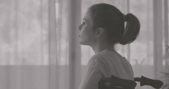 Sad lonely woman in wheelchair