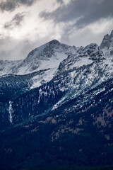 Fototapeta na wymiar snow capped jagged peaks of the Grand teton mountain range in wyoming during autumn.