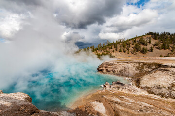 steaming hot springs and pools in the Lower Geyser Basin in Yellowstone National Park in Wyoming.