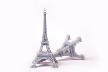 The miniature of the eiffel tower is made using a 3d printing machine. The eiffel tower is a monument located in France and has become an icon of that country. Suitable for your romantic destination.