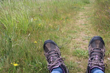 hiking boots on the grass
