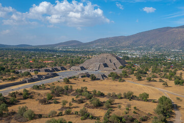 Naklejka premium Aerial view of Pyramid of the Moon from the top of Sun Pyramid in Teotihuacan in city of San Juan Teotihuacan, State of Mexico, Mexico. Teotihuacan is a UNESCO World Heritage Site since 1987. 
