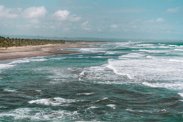 Waves on the beach with blue sky