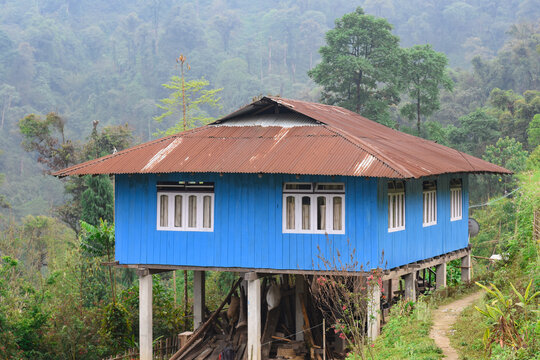 Traditional Lepcha Cottage with concrete pillars.