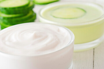 Fototapeta na wymiar Cucumber slices and face cream