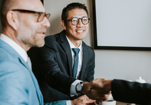 Corporate Businessman Shaking Hands In A Meeting