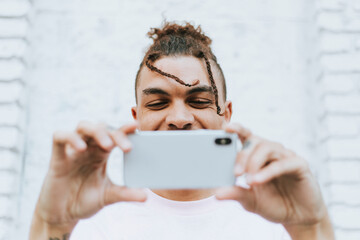 Man taking a selfie in downtown