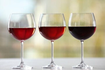 Different sorts of wine in glasses on table