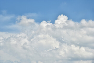 Beautiful white clouds on blue sky background.