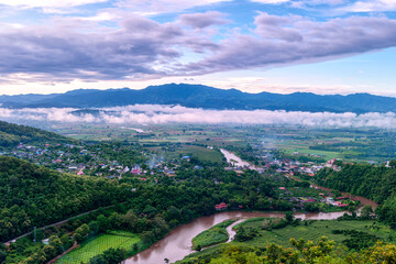 Aerial View of Tha Ton city in the valley with kok rivers, people houses and Temple Chiang Mai province Thailand.