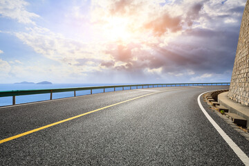 Fototapeta premium Asphalt highway go aside the bay of ocean.