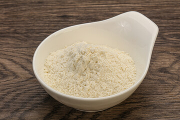 Wheat flour heap in the bowl