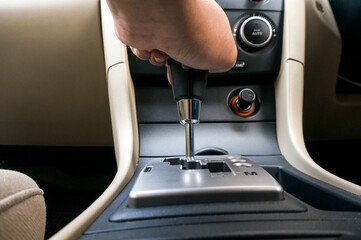 Man driving hands changing gear while driving in the car selective focus. safety driving